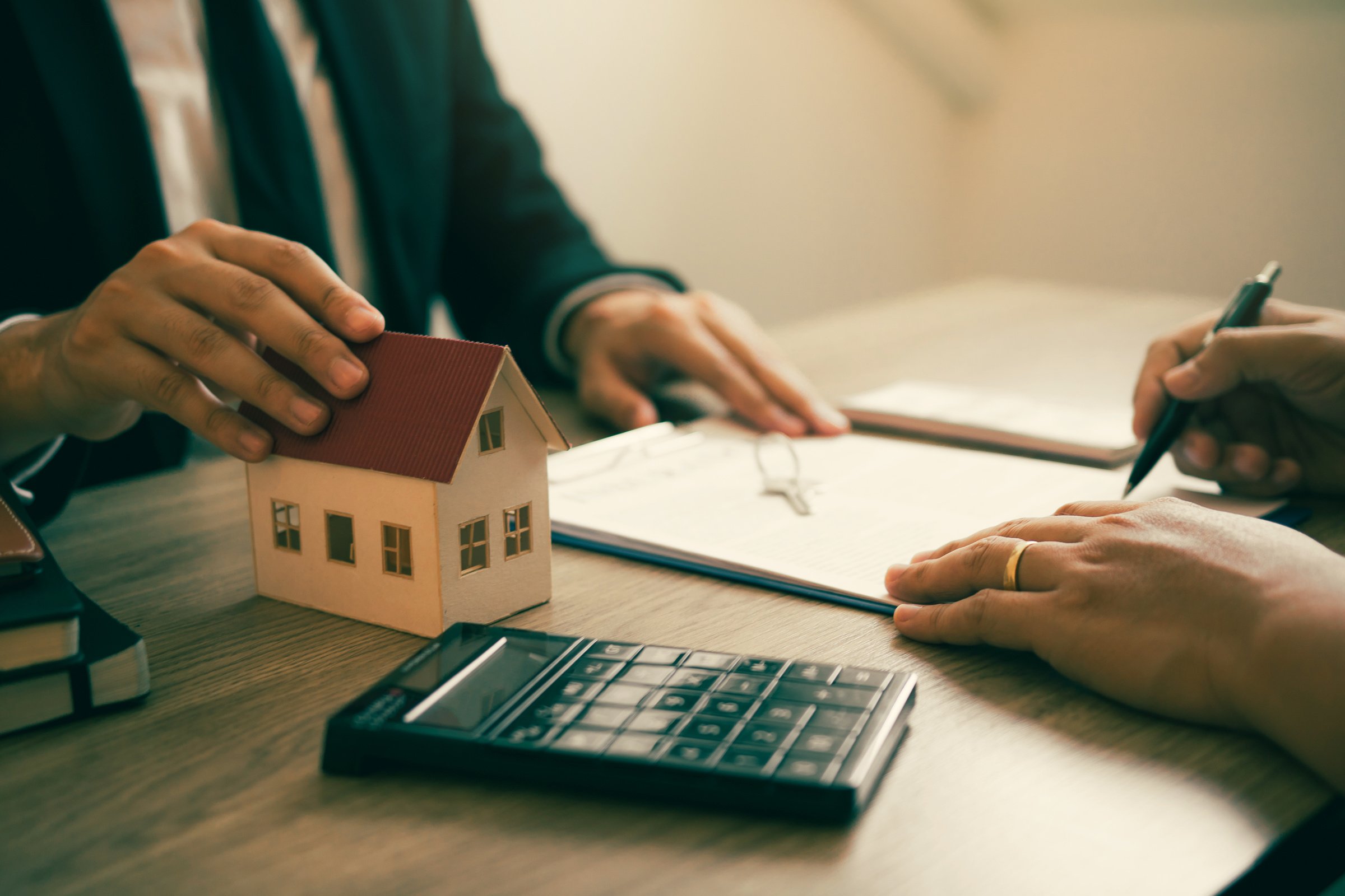 Real Estate Agent Letting Client Sign Contract